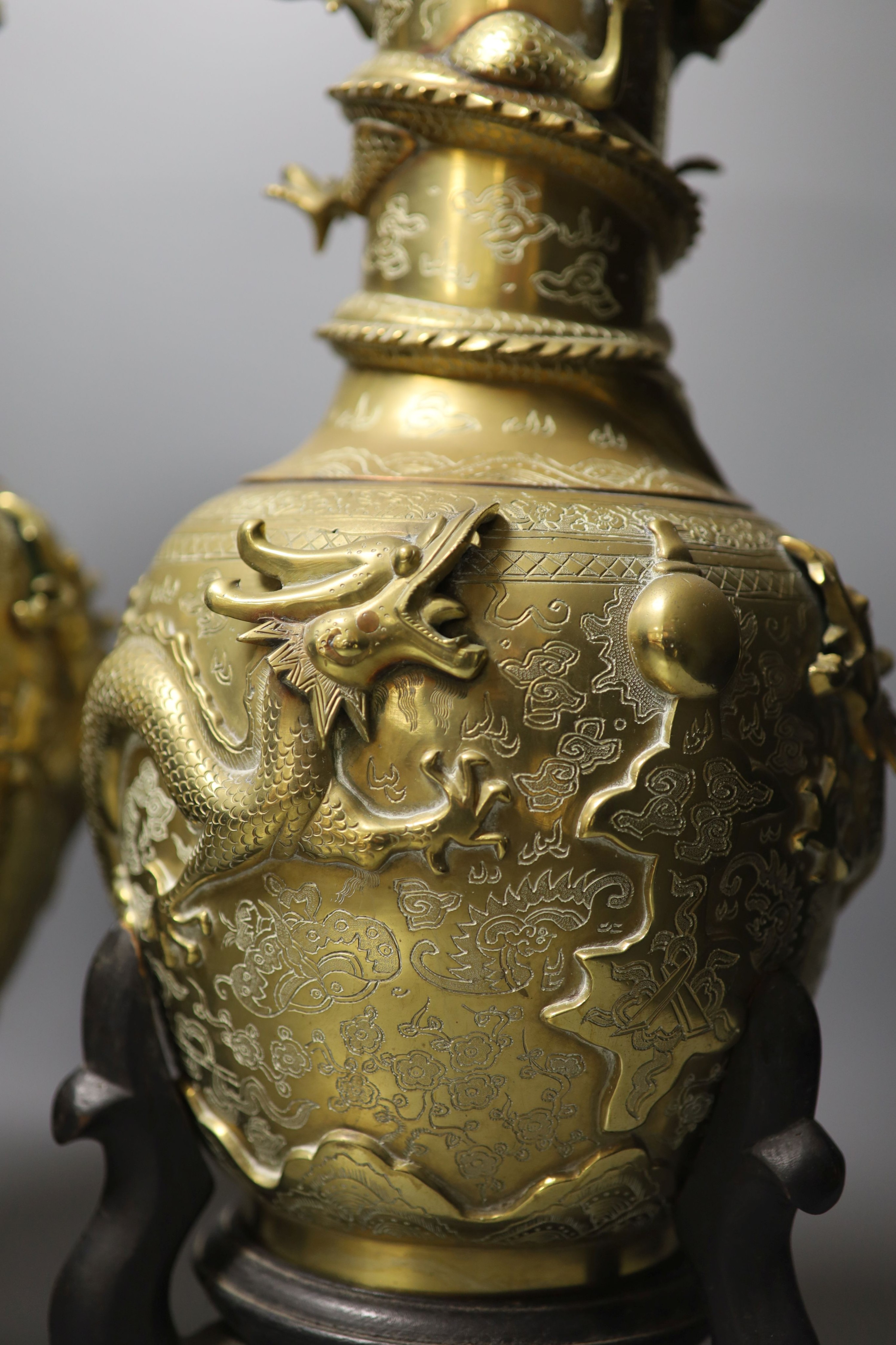 A pair of large Chinese bronze vases on stands, 45.5 cms high including stands